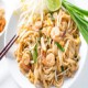 Phad Thai (spicy noodles with prawns ,vegetables and peanuts)